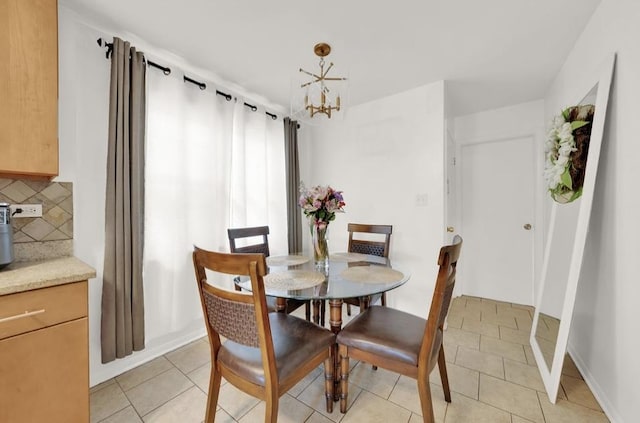 3617 W 63rd Pl, Chicago, IL 60629 - dining area featuring a chandelier and light tile patterned floors