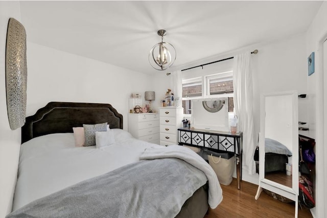 3617 W 63rd Pl, Chicago, IL 60629 - bedroom with a chandelier and wood finished floors