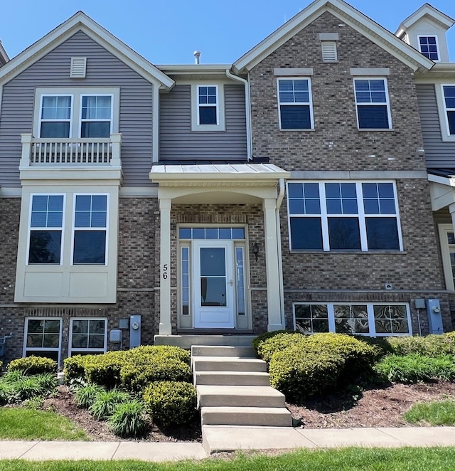 56 Veneto Ct, Streamwood, IL 60107 - view of front facade featuring brick siding