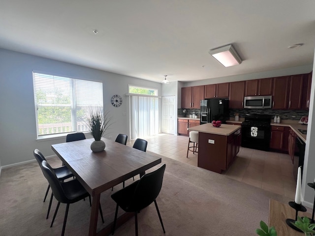 56 Veneto Ct, Streamwood, IL 60107 - dining room with light tile patterned floors and light carpet