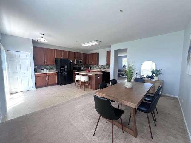 56 Veneto Ct, Streamwood, IL 60107 - dining room featuring light tile patterned floors and light colored carpet