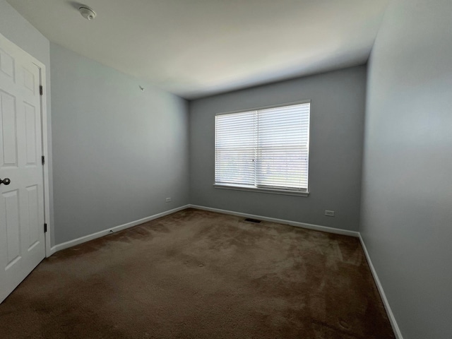 56 Veneto Ct, Streamwood, IL 60107 - carpeted empty room featuring baseboards and a smoke detector
