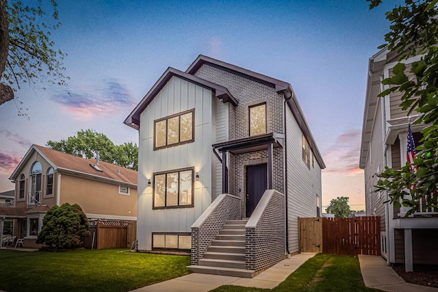 7635 W Balmoral Ave, Chicago, IL 60656 - view of front facade featuring board and batten siding and brick siding