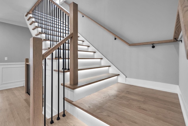 7635 W Balmoral Ave, Chicago, IL 60656 - staircase featuring wood finished floors and wainscoting