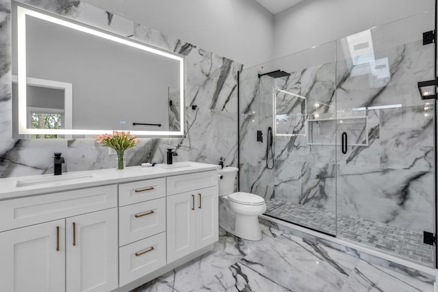 7635 W Balmoral Ave, Chicago, IL 60656 - full bath featuring tile walls, marble tiled flooring, a marble finish shower, and double vanity
