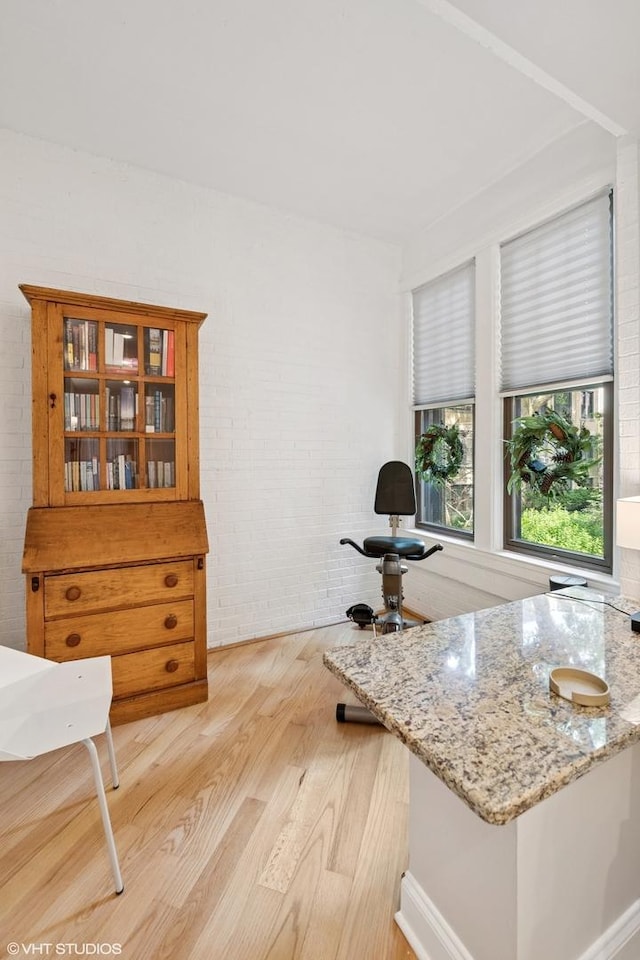 1219 W Lunt Ave Unit 1B, Chicago, IL 60626 - office space featuring light wood-type flooring and brick wall