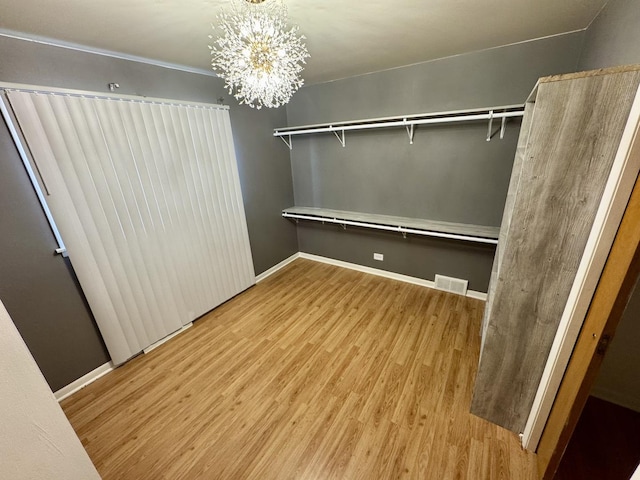 11137 S S Ave L, Chicago, IL 60617 - spacious closet with wood finished floors and a chandelier