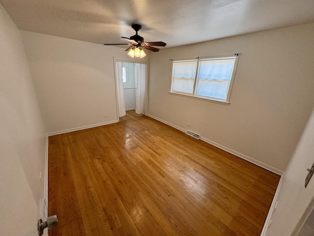 11137 S S Ave L, Chicago, IL 60617 - spare room with wood finished floors and a ceiling fan