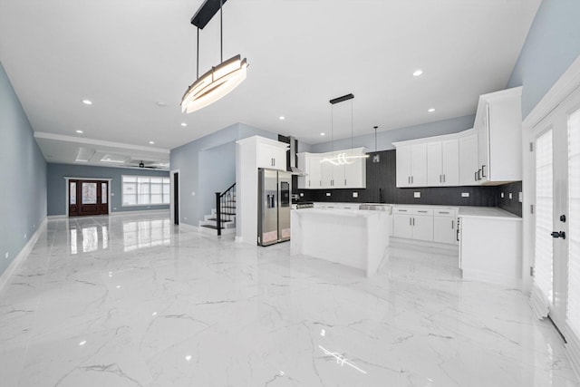 3628 S 54th Ct, Cicero, IL 60804 - kitchen featuring open floor plan, stainless steel refrigerator with ice dispenser, wall chimney exhaust hood, healthy amount of natural light, and recessed lighting