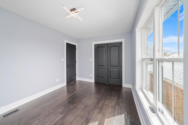 3628 S 54th Ct, Cicero, IL 60804 - empty room featuring dark wood-style floors and baseboards