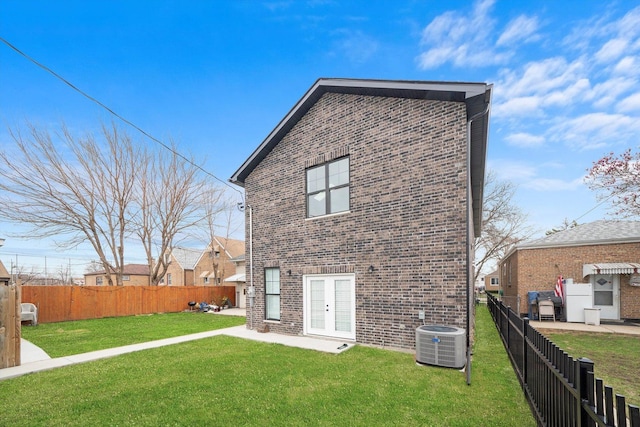 3628 S 54th Ct, Cicero, IL 60804 - back of property featuring french doors, brick siding, and a fenced backyard