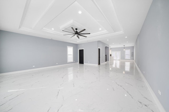 3628 S 54th Ct, Cicero, IL 60804 - unfurnished living room featuring healthy amount of natural light, a tray ceiling, recessed lighting, a ceiling fan, and light marble finish flooring