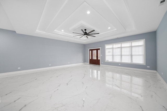 3628 S 54th Ct, Cicero, IL 60804 - unfurnished room with recessed lighting, a tray ceiling, a ceiling fan, and light marble finish flooring