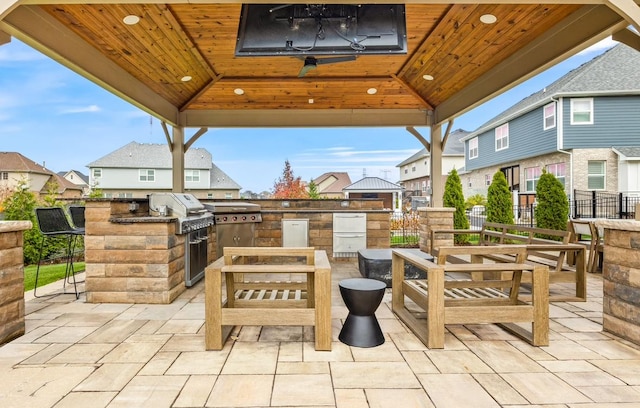 13052 Dunmoor Dr, Lemont, IL 60439 - view of patio / terrace with an outdoor kitchen, a gazebo, a residential view, and a ceiling fan