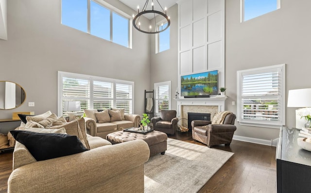 13052 Dunmoor Dr, Lemont, IL 60439 - living area featuring a high ceiling, a chandelier, a brick fireplace, and dark wood finished floors