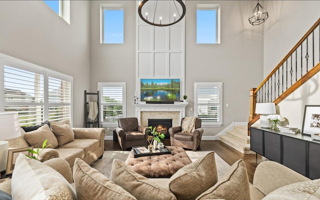 13052 Dunmoor Dr, Lemont, IL 60439 - living room featuring a high ceiling, stairway, dark wood-type flooring, a chandelier, and healthy amount of natural light