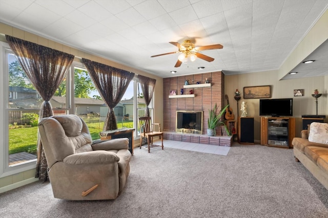 7306 W 115th St, Worth, IL 60482 - living area with carpet flooring, a ceiling fan, a fireplace, and crown molding