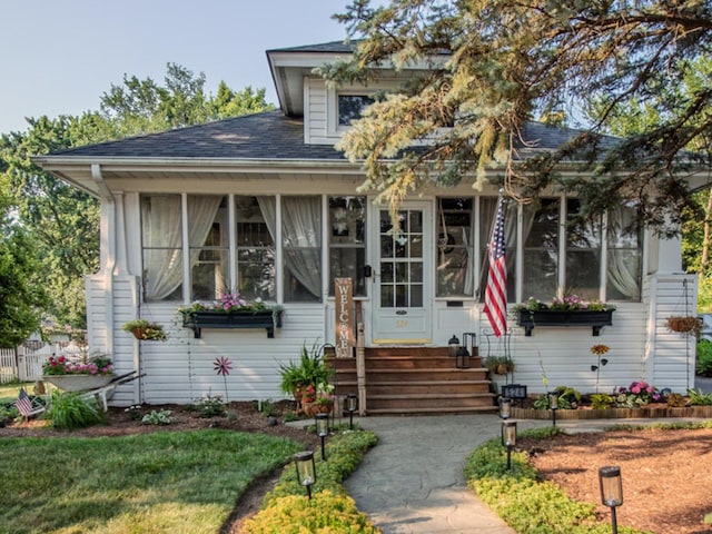 524 E 13th St, Lockport, IL 60441 - bungalow with a sunroom and roof with shingles
