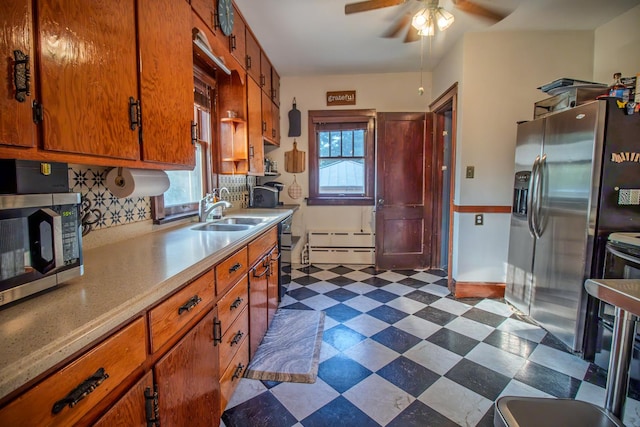524 E 13th St, Lockport, IL 60441 - kitchen with appliances with stainless steel finishes, dark floors, ceiling fan, light countertops, and backsplash