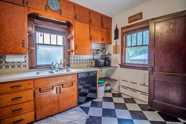 524 E 13th St, Lockport, IL 60441 - kitchen with dishwasher, dark flooring, light countertops, and tasteful backsplash