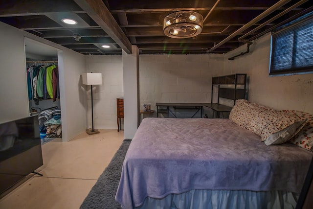 524 E 13th St, Lockport, IL 60441 - bedroom with concrete floors, concrete block wall, and a closet