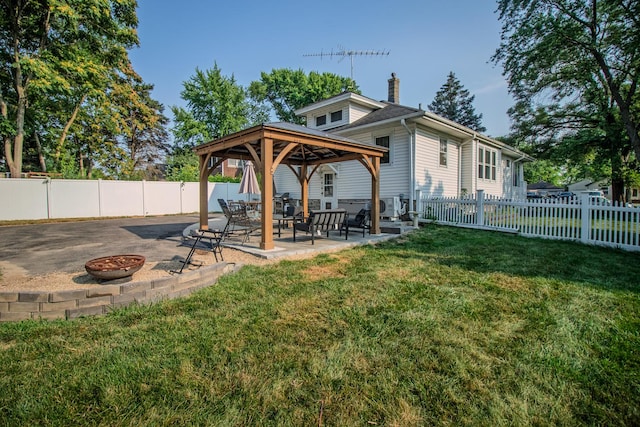 524 E 13th St, Lockport, IL 60441 - fenced backyard featuring a fire pit, a gazebo, and a patio area