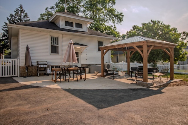 524 E 13th St, Lockport, IL 60441 - back of house featuring a gazebo, a patio, an outdoor living space, and outdoor dining area
