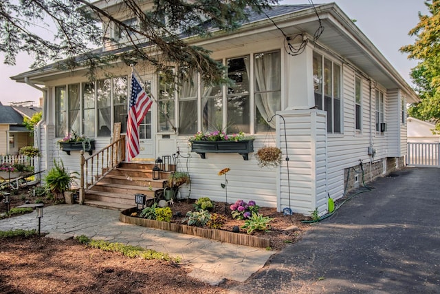 524 E 13th St, Lockport, IL 60441 - view of front of property featuring a sunroom and driveway