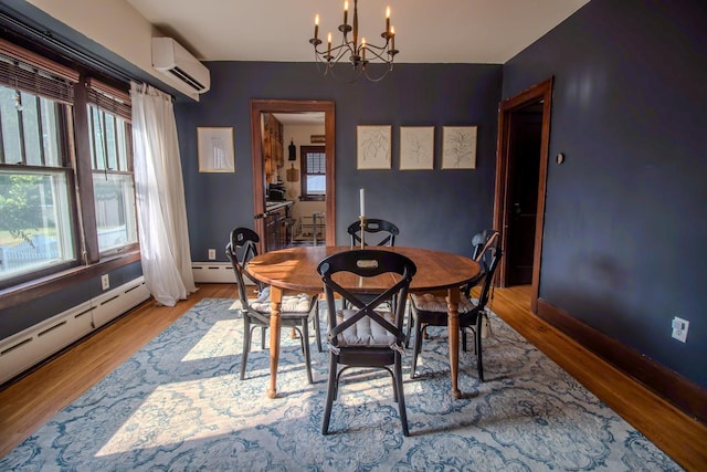 524 E 13th St, Lockport, IL 60441 - dining room featuring an AC wall unit, a chandelier, plenty of natural light, and light wood-style floors