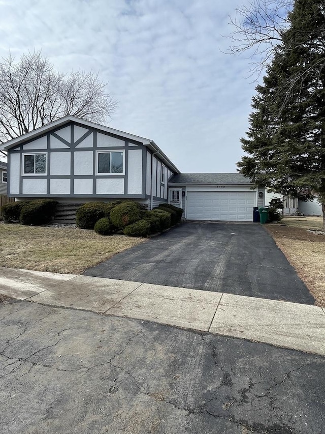2100 Lloyd Ave, Lombard, IL 60148 - view of front facade featuring driveway, a garage, and stucco siding