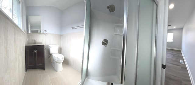 2100 Lloyd Ave, Lombard, IL 60148 - bathroom with a stall shower, vanity, tile walls, and recessed lighting