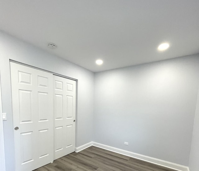 2100 Lloyd Ave, Lombard, IL 60148 - unfurnished bedroom with dark wood-style floors, recessed lighting, and a closet