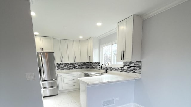 2100 Lloyd Ave, Lombard, IL 60148 - kitchen with appliances with stainless steel finishes, crown molding, backsplash, a peninsula, and recessed lighting