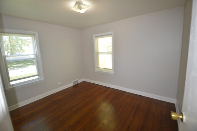 7921 Niles Ave, Skokie, IL 60077 - unfurnished room with healthy amount of natural light and dark wood-style floors