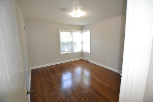 7921 Niles Ave, Skokie, IL 60077 - unfurnished room featuring wood finished floors and baseboards