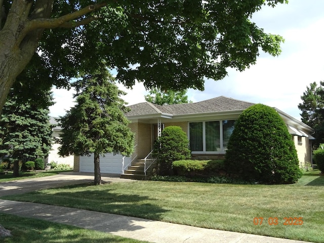 475 Courtesy Ln, Des Plaines, IL 60018 - view of front of house featuring driveway, an attached garage, a front lawn, and brick siding