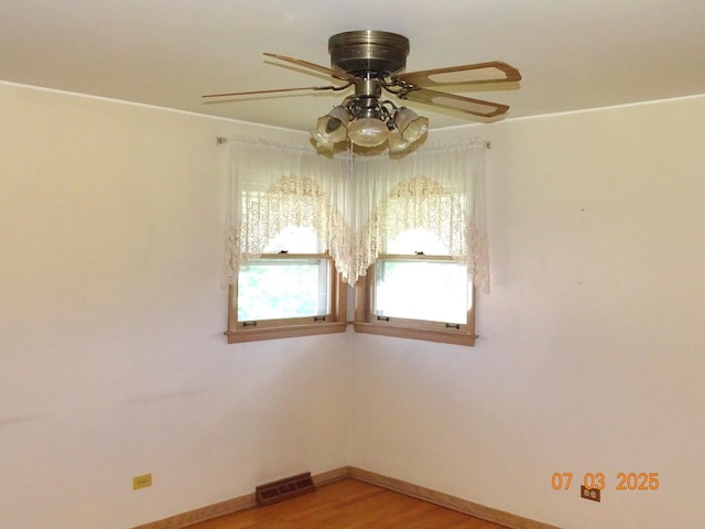 475 Courtesy Ln, Des Plaines, IL 60018 - empty room with a ceiling fan and light wood-style flooring