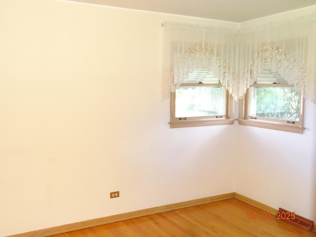 475 Courtesy Ln, Des Plaines, IL 60018 - spare room with baseboards and light wood-style floors