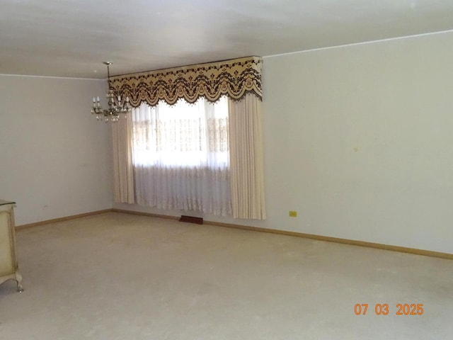 475 Courtesy Ln, Des Plaines, IL 60018 - unfurnished room featuring a chandelier and carpet flooring