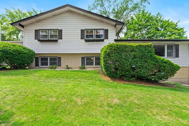 3717 W High St, Mchenry, IL 60050 - back of house with brick siding and a lawn