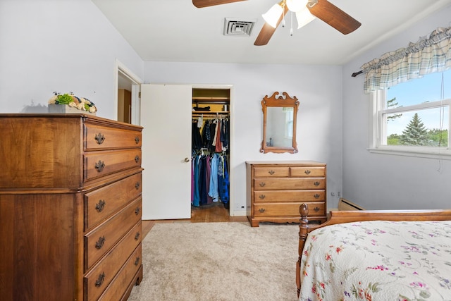 3717 W High St, Mchenry, IL 60050 - bedroom featuring baseboard heating, a walk in closet, and a ceiling fan