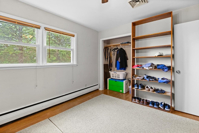3717 W High St, Mchenry, IL 60050 - bedroom featuring a baseboard heating unit and a closet
