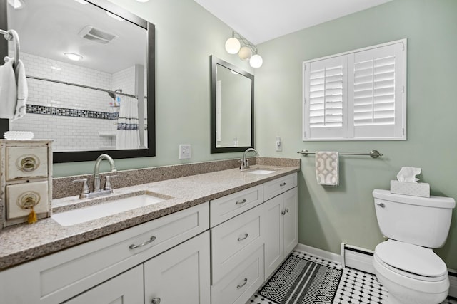 3717 W High St, Mchenry, IL 60050 - bathroom with double vanity, a tile shower, and a baseboard radiator