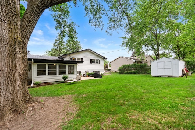 3717 W High St, Mchenry, IL 60050 - view of grassy yard with a storage shed and a patio area