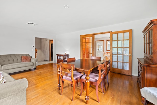3717 W High St, Mchenry, IL 60050 - dining space with french doors and light wood-style floors