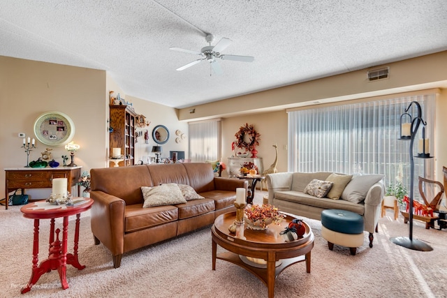 1503 Woodbridge Rd Unit 3E, Joliet, IL 60436 - living area featuring light colored carpet, healthy amount of natural light, ceiling fan, and a textured ceiling