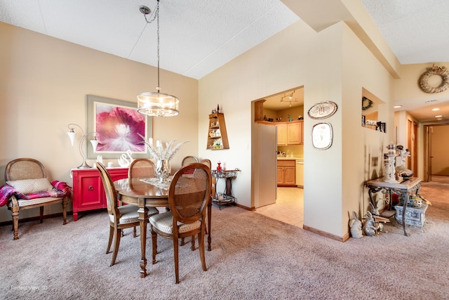 1503 Woodbridge Rd Unit 3E, Joliet, IL 60436 - dining area featuring light carpet, vaulted ceiling, and a textured ceiling