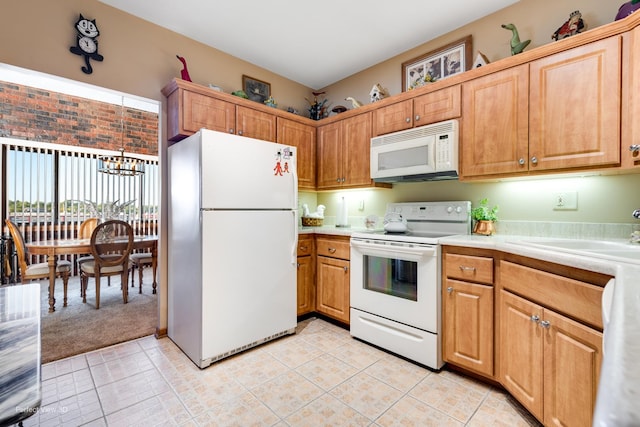 1503 Woodbridge Rd Unit 3E, Joliet, IL 60436 - kitchen featuring white appliances, light countertops, a chandelier, and light tile patterned flooring