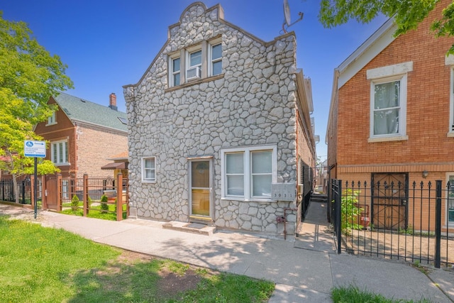 3031 S Central Park Ave, Chicago, IL 60623 - view of front of home with stone siding and a gate