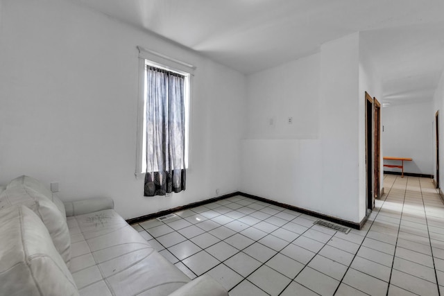 3031 S Central Park Ave, Chicago, IL 60623 - unfurnished living room featuring light tile patterned floors and baseboards